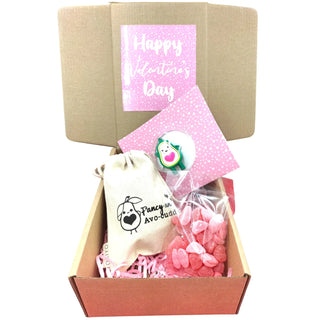 Gift box with 'Happy Valentine's Day' card, pink candy, and a small bag with a logo.