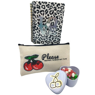 Cherry-picked gift set with red cherry-themed packaging and luxury treats on a white background