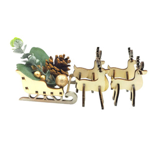Decorative wooden sleigh with reindeer and Christmas decorations on a white background