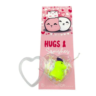 squishy toy with a heart design and pink valentines card