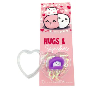 squishy toy with a heart design and pink valentines card