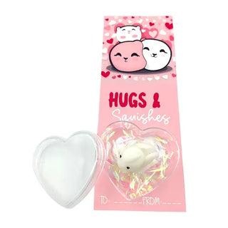 squishy toy with a heart design and pink valentines card