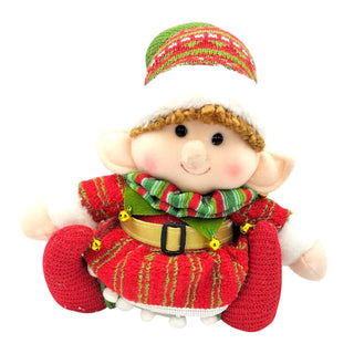 Elf figurine with red and green outfit on a white background