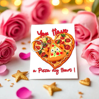 Card with pizza heart design and 'You have a Pizza my heart!' text, surrounded by pink roses and decorative items.