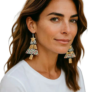 Woman wearing colorful triangle earrings on a white background
