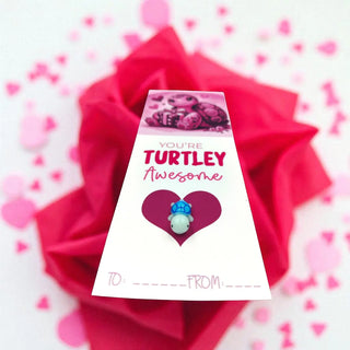 Card with 'You're Turtley Awesome' text and turtle illustration on a pink rose background