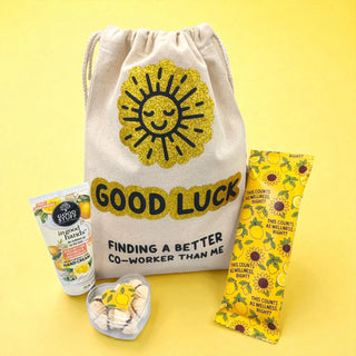 Good Luck drawstring bag with sun design and products on a yellow background