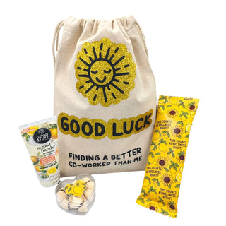 Good luck gift set with sun-themed items on a white background