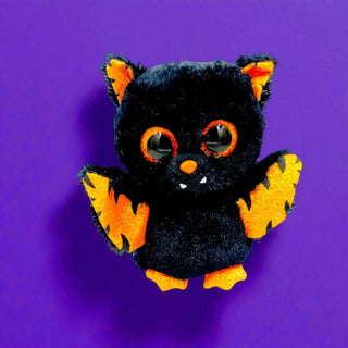 bat plush on a purple backdrop