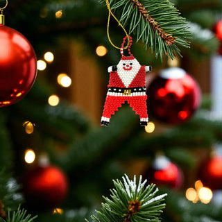 Beaded Santa Claus ornament hanging on a Christmas tree with blurred lights in the background