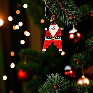 Pixelated Santa Claus ornament hanging on a Christmas tree with blurred lights in the background