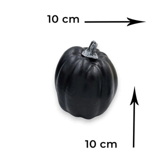 Black pumpkin with measurements indicated on a white background
