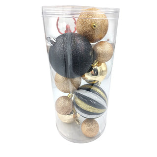 Clear container with gold, black, and silver Christmas ornaments on a white background