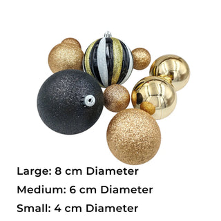 Decorative Christmas balls in gold, black, and silver on a white background with size labels.