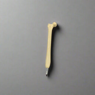 Pen with a bone-shaped handle on a gray background
