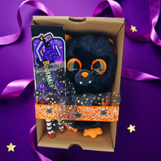 Halloween gift set with bat plush and witchy BOOKmark on purple backdrop