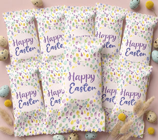 Packaging with 'Happy Easter' text and Easter egg designs on a pink background
