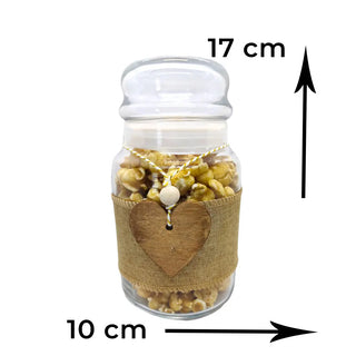 Heart-shaped caramel popcorn gift with clear packaging and festive ribbon on a white background
