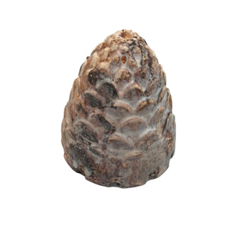 Decorative stone sculpture of a pine cone on a white background