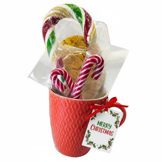 Red mug with cookies, candy canes, and a 'Merry Christmas' tag on a white background