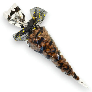 Chocolate peanuts in a clear black bat cellophane bag on white background