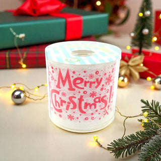 Decorative candle with 'Merry Christmas' text in a festive setting with lights and presents.