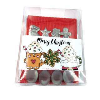 Set of Christmas-themed cookie cutters in a clear packaging with a decorative label.