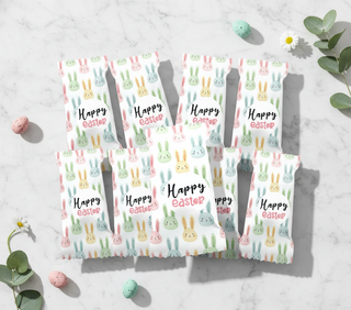 Easter eggs with Easter bunny pattern and 'Happy Easter' text on a light gray background.