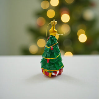 Decorative Christmas tree figurine with a blurred festive background