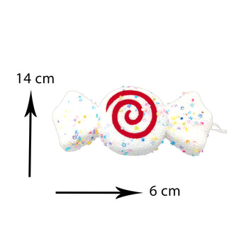 White candy-shaped Christmas tree ornament with colorful sprinkle details, photographed on a neutral background.