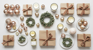 Christmas decorations including gift boxes, candles, and ornaments on a white background