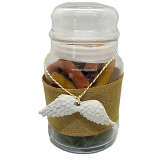 Dried fruit snack gift shaped like wings with elegant packaging on a white background