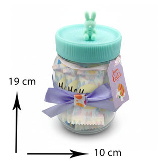 Small jar with a decorative bow and rabbit figure on a white background