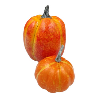 Two small orange pumpkins with yellow stripes on a white background