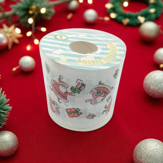 Roll of paper towels with Christmas design on a red background with festive decorations