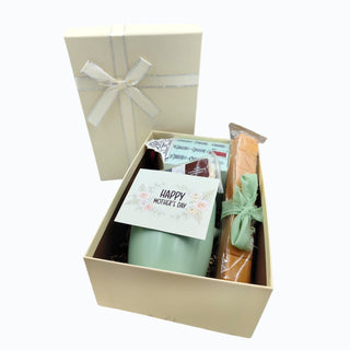 Gift box with a 'Happy Mother's Day' card, mug, and other items on a white background