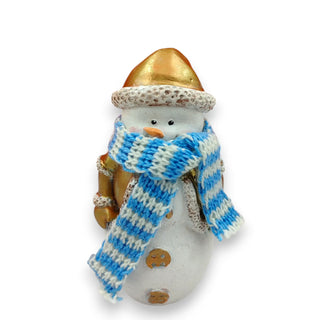 Snowman figurine with a gold hat and blue and white striped scarf on a white background
