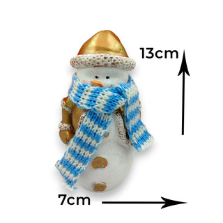Small snowman figurine with a blue and white striped scarf, gold hat, and measurements indicated on a white background.