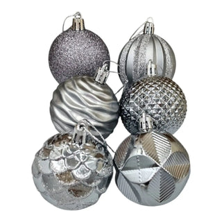 Set of silver and gray Christmas ornaments on a white background