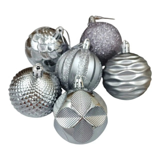 Silver Christmas ornaments with various textures on a white background