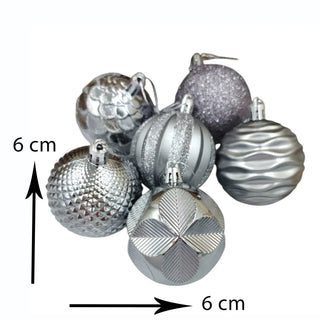 Silver Christmas ornaments with a measurement label indicating 6 cm on a white background