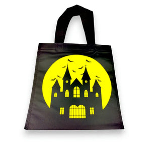 Black tote bag with a yellow haunted house design on a white background