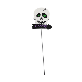 white skull with green eyes above sign written "spooky" in purple