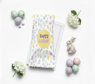 Easter card with colorful eggs and 'Happy Easter' text, surrounded by decorative eggs and a rabbit figurine on a white background.
