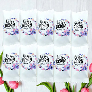Packets with 'He is Risen' text and floral design on a white background with tulips.