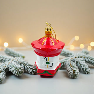 Decorative red lantern ornament with gold accents on a white background, traditional red christmas aesthetic