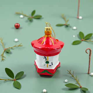 Decorative red lantern ornament with gold accents on a white background, traditional red christmas aesthetic