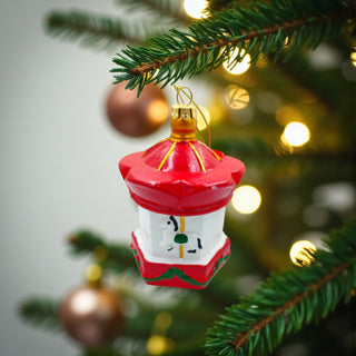 Decorative red lantern ornament with gold accents on a white background, traditional red christmas aesthetic