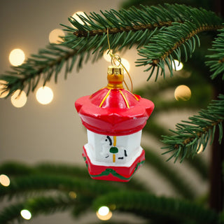 Decorative red lantern ornament with gold accents on a white background, traditional red christmas aesthetic