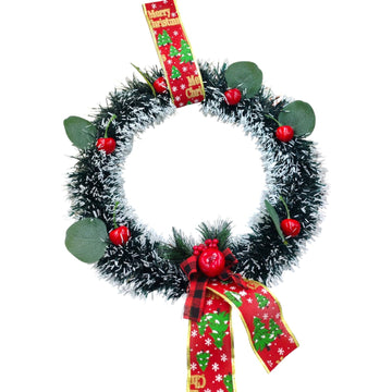 Christmas wreath with red berries and a plaid ribbon on a white background
